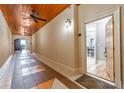 Inviting hallway with decorative tile and a view into the unit's dining area at 825 Highland Ln # 1105, Atlanta, GA 30306
