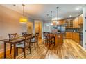 Bright eat-in kitchen featuring a stainless steel refrigerator and a center island with bar stool seating at 825 Highland Ln # 1105, Atlanta, GA 30306
