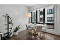 Dining area featuring a modern table and chairs, large window with neighborhood view at 105 City View Ne Ct, Atlanta, GA 30308