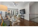 Open-concept living area with hardwood floors and shiplap accent wall at 105 City View Ne Ct, Atlanta, GA 30308