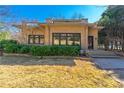 Attractive brick house with a flat roof, complemented by neatly trimmed bushes and a well-maintained front lawn at 1181 Fairview Ne Rd, Atlanta, GA 30306