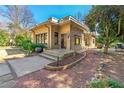 Stylish home featuring a flat roof and brick facade, set amongst a beautifully landscaped yard with mature trees and shrubbery at 1181 Fairview Ne Rd, Atlanta, GA 30306