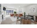 Spacious living room features neutral paint, a fireplace, with ample natural light from the large windows at 24308 Plantation Ne Dr, Atlanta, GA 30324