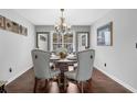 Elegant dining room featuring a round table, upholstered chairs, and a stylish chandelier at 3135 Nectar Dr, Powder Springs, GA 30127