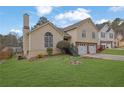 Street view showcasing the home's architectural details, well-kept lawn, and pleasant neighborhood setting at 3135 Nectar Dr, Powder Springs, GA 30127