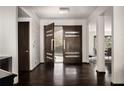 Inviting entryway featuring dark hardwood floors and modern double doors with glass accents at 437 Hollydale Nw Ct, Atlanta, GA 30342