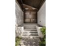 Close-up of the home's impressive front entrance with double doors and stone details at 437 Hollydale Nw Ct, Atlanta, GA 30342