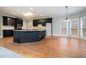 Modern kitchen with stainless steel appliances and a large center island and breakfast area at 3502 Crown Peak Ct, Suwanee, GA 30024