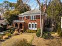 Beautiful two-story brick home featuring a balcony, arched entryway and landscaped yard at 1272 Oakdale Ne Rd, Atlanta, GA 30307