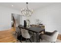 Elegant dining room with a modern chandelier, sleek table, and stylish chairs, perfect for entertaining at 239 E Wesley Ne Rd, Atlanta, GA 30305