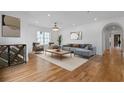 Bright living room featuring hardwood floors, a modern sofa, and elegant decor, creating an inviting atmosphere at 239 E Wesley Ne Rd, Atlanta, GA 30305