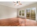 Bright living room showcasing hardwood floors, natural light, and a sliding door to the deck at 1537 Liberty Nw Pkwy, Atlanta, GA 30318