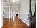 Inviting foyer featuring gleaming hardwood floors and neutral paint at 2984 Berry Rd, Loganville, GA 30052