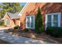 Close up of charming landscaping details and brick exterior at 330 Todwick Dr, Roswell, GA 30075