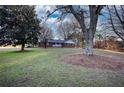 Traditional home with a brick facade surrounded by mature trees at 26 Loyd Cemetery Rd, Newborn, GA 30056