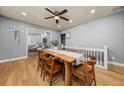 Open dining room featuring hardwood floors and a modern table with seating for six at 1707 Terry Mill Se Rd, Atlanta, GA 30316