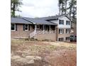 Attractive brick and vinyl two-story home featuring a covered porch and traditional design elements at 2724 Hickory Smoke Ct, Snellville, GA 30078