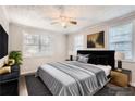 Cozy staged bedroom featuring modern décor, soft lighting, and a comfortable bed at 1383 Almont Sw Dr, Atlanta, GA 30310