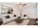 Bright living room with modern furnishings, natural light, and hardwood floors at 1383 Almont Sw Dr, Atlanta, GA 30310