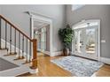 Bright foyer features hardwood floors, white trim, and double doors leading to the home's exterior at 2728 Long Grove Dr, Marietta, GA 30062