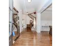 Bright foyer boasts hardwood floors, elegant staircase, and decorative mirror at 3621 Sutters Pond Way, Kennesaw, GA 30152