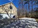 Spacious driveway with a two-car garage, perfect for parking multiple vehicles at 1734 Victoria Nw Way, Kennesaw, GA 30152