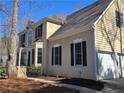 Stunning home features a 2-car garage, complementary siding and paint, and a manicured front yard at 1734 Victoria Nw Way, Kennesaw, GA 30152