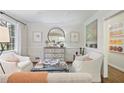 Cozy living room featuring bright natural light, white walls and elegant furniture arrangement at 465 Pine Forest Rd, Atlanta, GA 30342