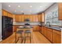 Well-lit kitchen featuring stainless steel appliances, granite countertops, and an island with breakfast bar at 1016 Parkmont Way, Decatur, GA 30033