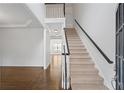 Bright foyer with hardwood floors and staircase, offering a welcoming entrance at 2620 Milford Ln, Alpharetta, GA 30009