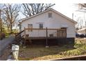 Side of a home with a spacious wooden deck and mature trees at 61 Daisy Cir, Canton, GA 30114