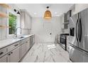 Modern kitchen with stainless steel appliances, sleek countertops, and ample cabinet space at 1015 Michigan Nw Ave, Atlanta, GA 30314