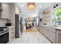 Bright, updated kitchen featuring stainless steel appliances, shaker cabinets and hexagon tile floors at 1015 Michigan Nw Ave, Atlanta, GA 30314
