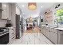 Beautiful open-concept kitchen with modern appliances, tile flooring, and access to the living and dining areas at 1015 Michigan Nw Ave, Atlanta, GA 30314