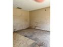 Bedroom with unfinished floors, damaged walls, and visible electrical outlets at 13101 Waldrop Cv, Decatur, GA 30034