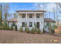 Charming two-story home with a welcoming front porch and beautifully landscaped front yard at 5664 Colton Dr, Atlanta, GA 30342