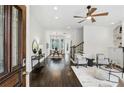 Open-concept living room with hardwood floors and a modern ceiling fan at 611 Irwin Ne St, Atlanta, GA 30312