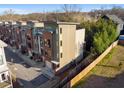 Aerial view of modern townhomes showcasing contemporary design and landscaping at 975 Moda Dr, Atlanta, GA 30316