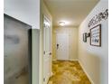 Welcoming entryway featuring tile flooring, neutral walls, and decorative accents, leading into the home at 1155 Magnolia Gardens Walk, Mcdonough, GA 30253