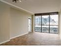 Spacious living room with large windows offering city views at 1280 W Peachtree Nw St # 3709, Atlanta, GA 30309