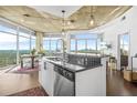 Stylish eat-in kitchen boasts an island, city views, and modern decor at 250 Pharr Ne Rd # 1618, Atlanta, GA 30305