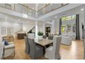 Bright living room with soaring ceilings, hardwood floors, large windows, and an open concept design at 4201 Brookview Se Dr, Atlanta, GA 30339