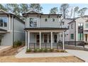 Charming two-story home featuring a welcoming front porch, clean lines and modern design at 662 Timm Valley Ne Rd, Atlanta, GA 30305