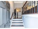 Inviting entryway with hardwood floors, staircase, and decorative mirror at 873 Cedar River Se Ct, Marietta, GA 30067