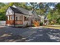 Charming white brick home with covered porch and wood shutters at 985 Columbia Dr, Decatur, GA 30030
