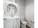 Clean bathroom with modern vanity, stylish mirror, and well-maintained toilet and fixtures at 1297 Quail Hunt Dr, Riverdale, GA 30296
