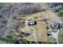 An aerial view showing two homes, highlighting their layout and generous lot sizes in a wooded area at 1603 Drowning Creek Rd, Dacula, GA 30019