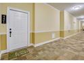 Inviting condo hallway with a 'Just Peachy' welcome mat, leading to comfortable living at 1910 Cedar Glenn Way # 4401, Atlanta, GA 30339