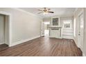 Bright living room with hardwood floors, a decorative fireplace, and french doors to the outside at 495 Hutchens Se Rd, Atlanta, GA 30354