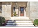 Inviting front entrance with a detailed wood door and manicured landscaping at 333 Pineland Nw Rd, Atlanta, GA 30342